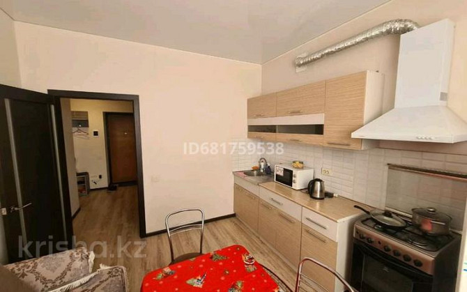 1-комнатная квартира, 50 м², 9/9 этаж посуточно, Алии Молдагуловой 30б — Ал/молдагулова Актобе - изображение 4